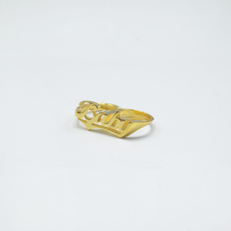 two finger handmade gold baby ring custom letter old school new york street type jewellery on white background